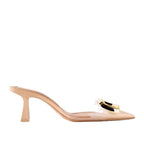 Beige stiletto mule with a transparent strap, pointed toe, and a prominent gold-tone metal buckle detail.