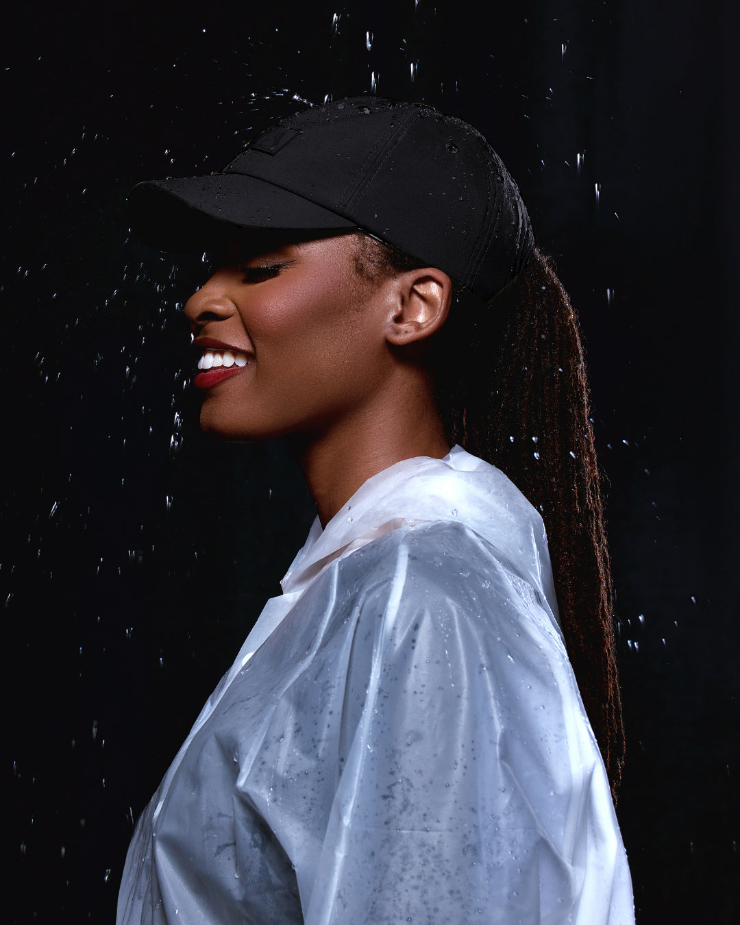Black waterproof satin-lined dad hat with a curved brim, designed for rain protection and stylish casual wear.