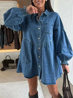 Casual button-down mini denim dress with front pockets, trendy Trendsi brand, stylish and comfortable for everyday wear.