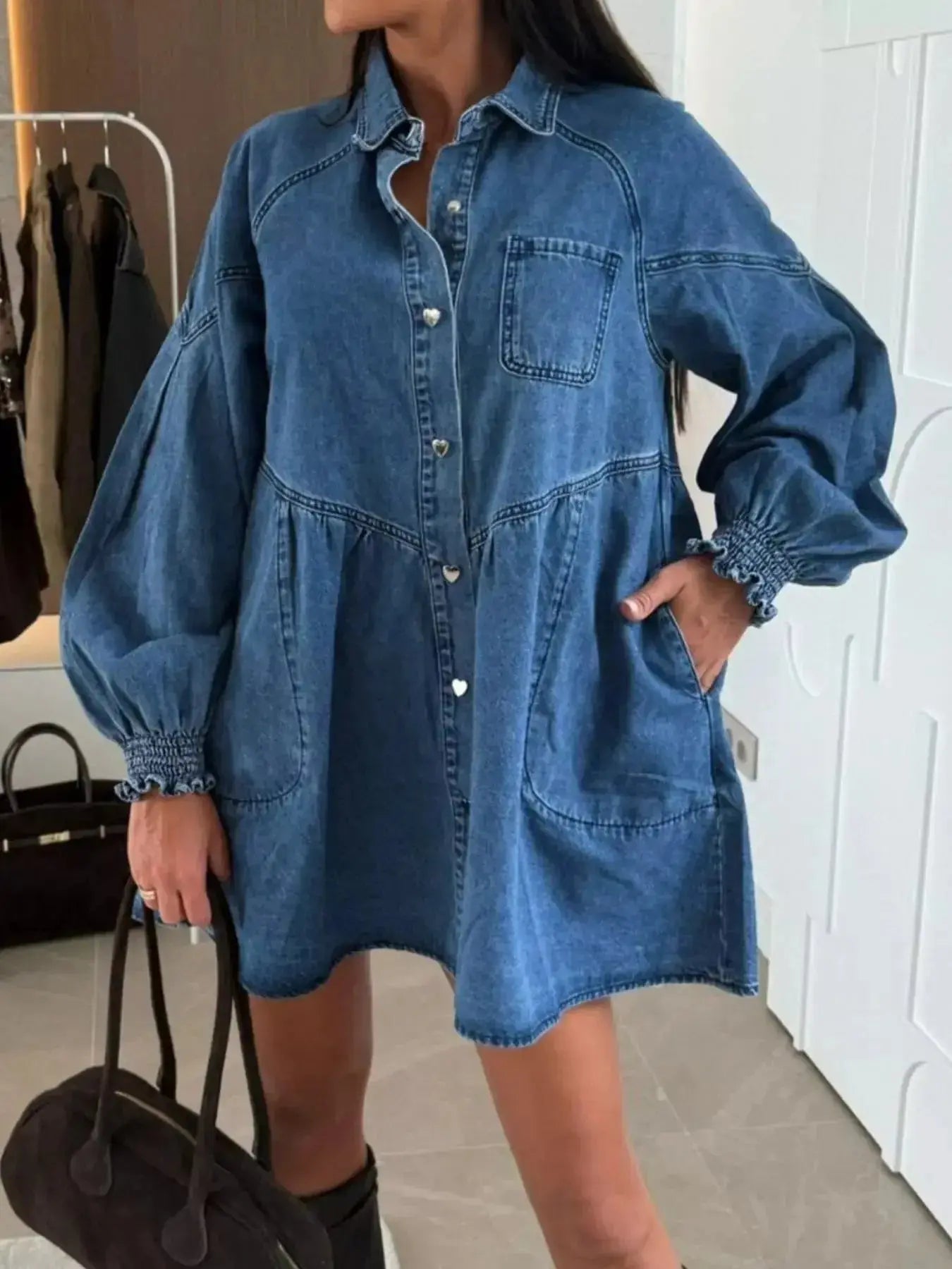 Casual button-down mini denim dress with front pockets, featuring long sleeves and a relaxed fit from Trendsi.