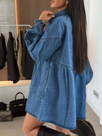 Casual mini denim dress with front pockets, button-down style by Trendsi, displayed on a hanger, perfect for everyday wear.