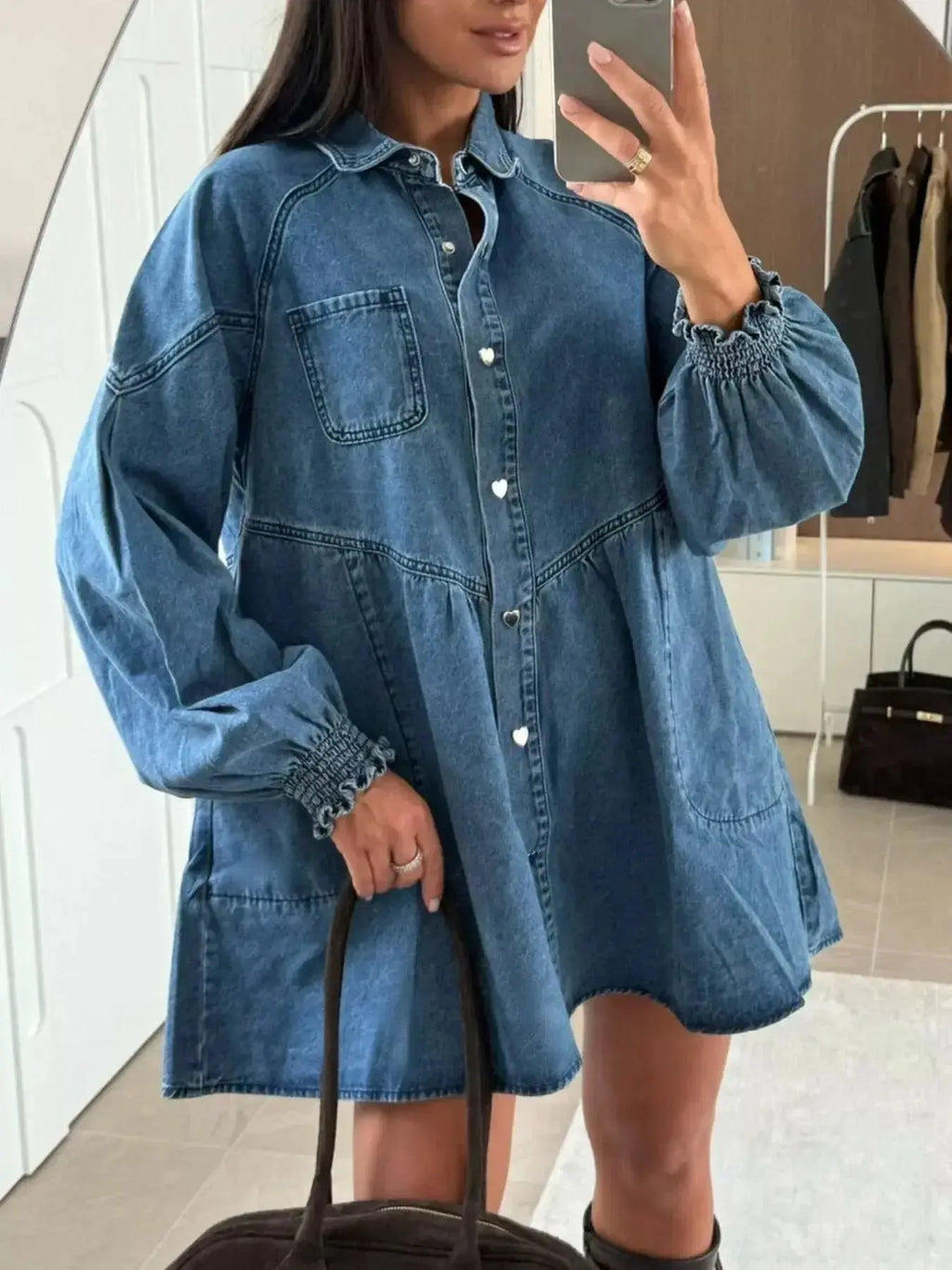 Casual denim mini dress with button-down front and front pockets, featuring a trendy, relaxed fit by Trendsi.