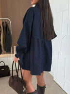 Casual mini denim dress by Trendsi with button-down front and front pockets, perfect for a relaxed, stylish look.