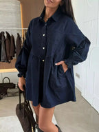Casual mini denim dress with button-down front and front pockets, stylish Trendsi denim dress for everyday wear.