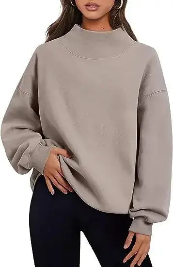 Women’s soft fleece half-turtleneck sweater in a casual loose fit, from Plush Fashion Hub, perfect for cozy loungewear.