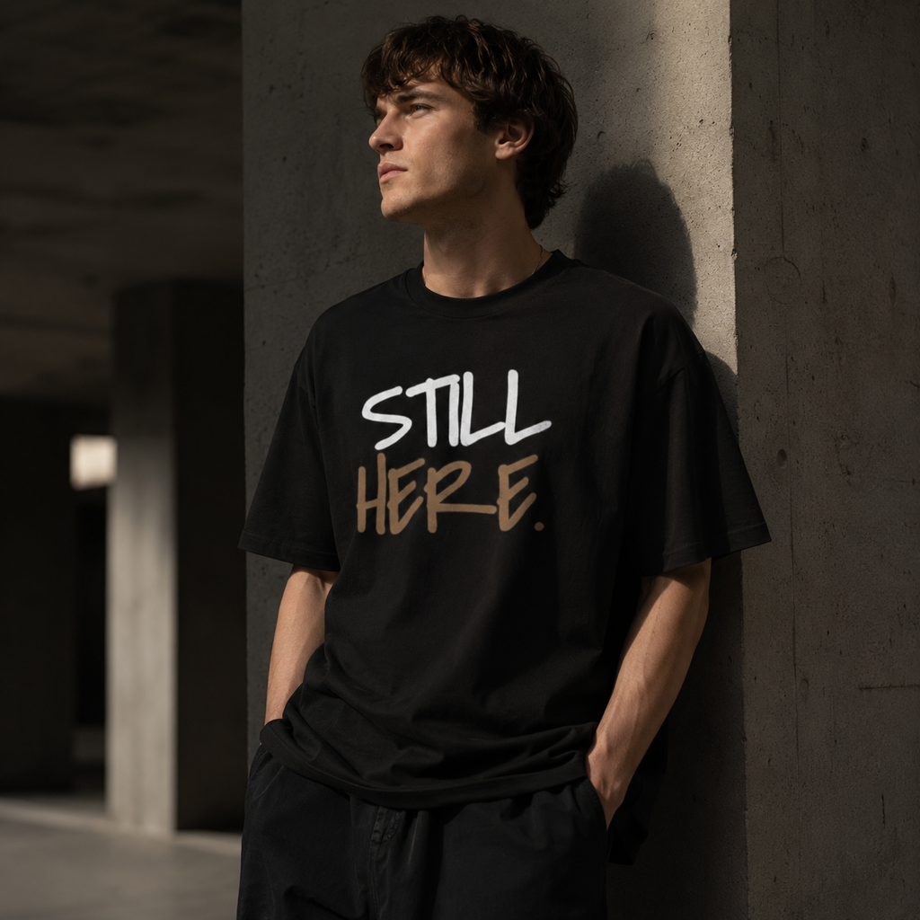 Wear Your Worship Still Here Tee, motivational streetwear shirt with mental health and resilience graphic design.