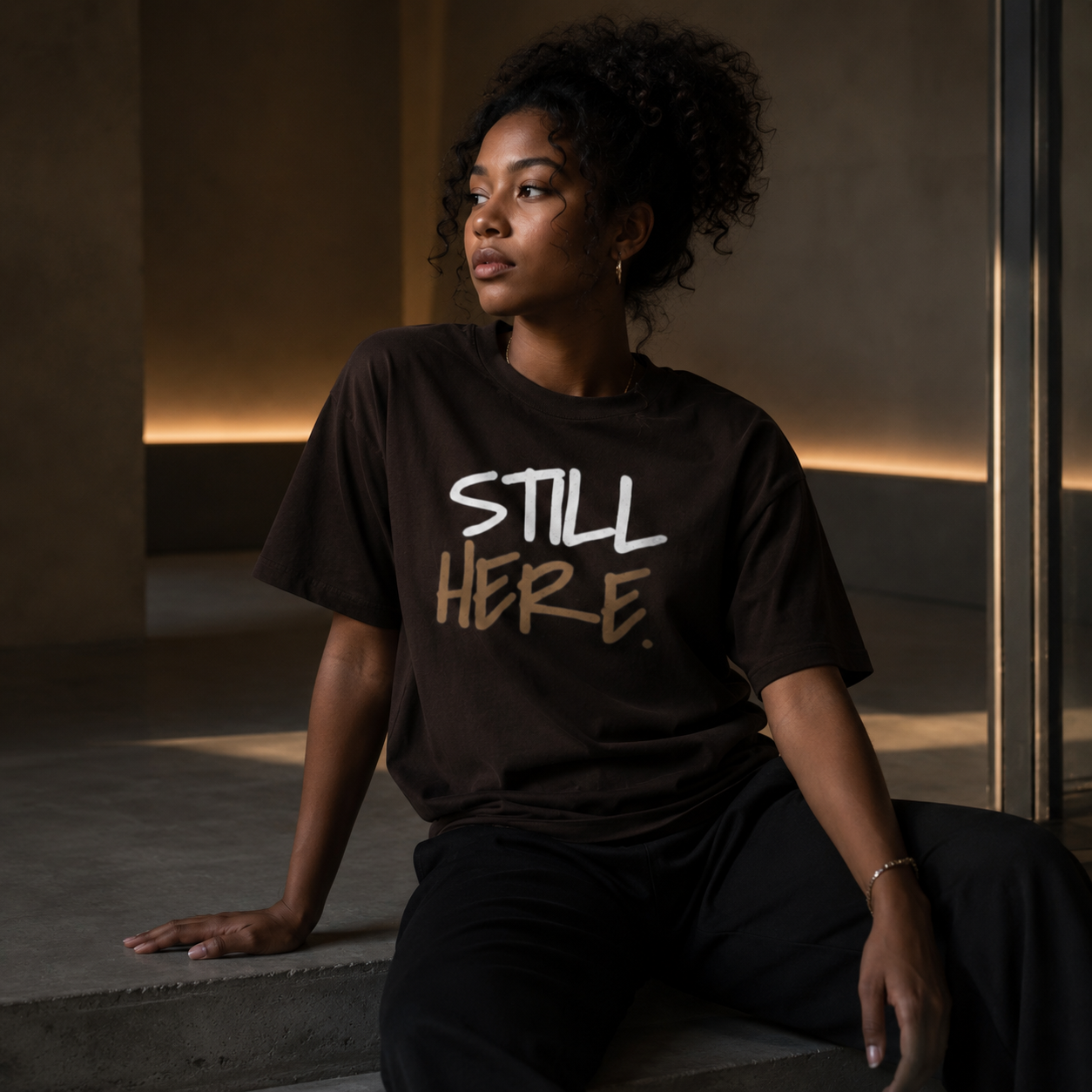 Wear Your Worship Still Here T-Shirt featuring motivational mental health and resilience graphic design.