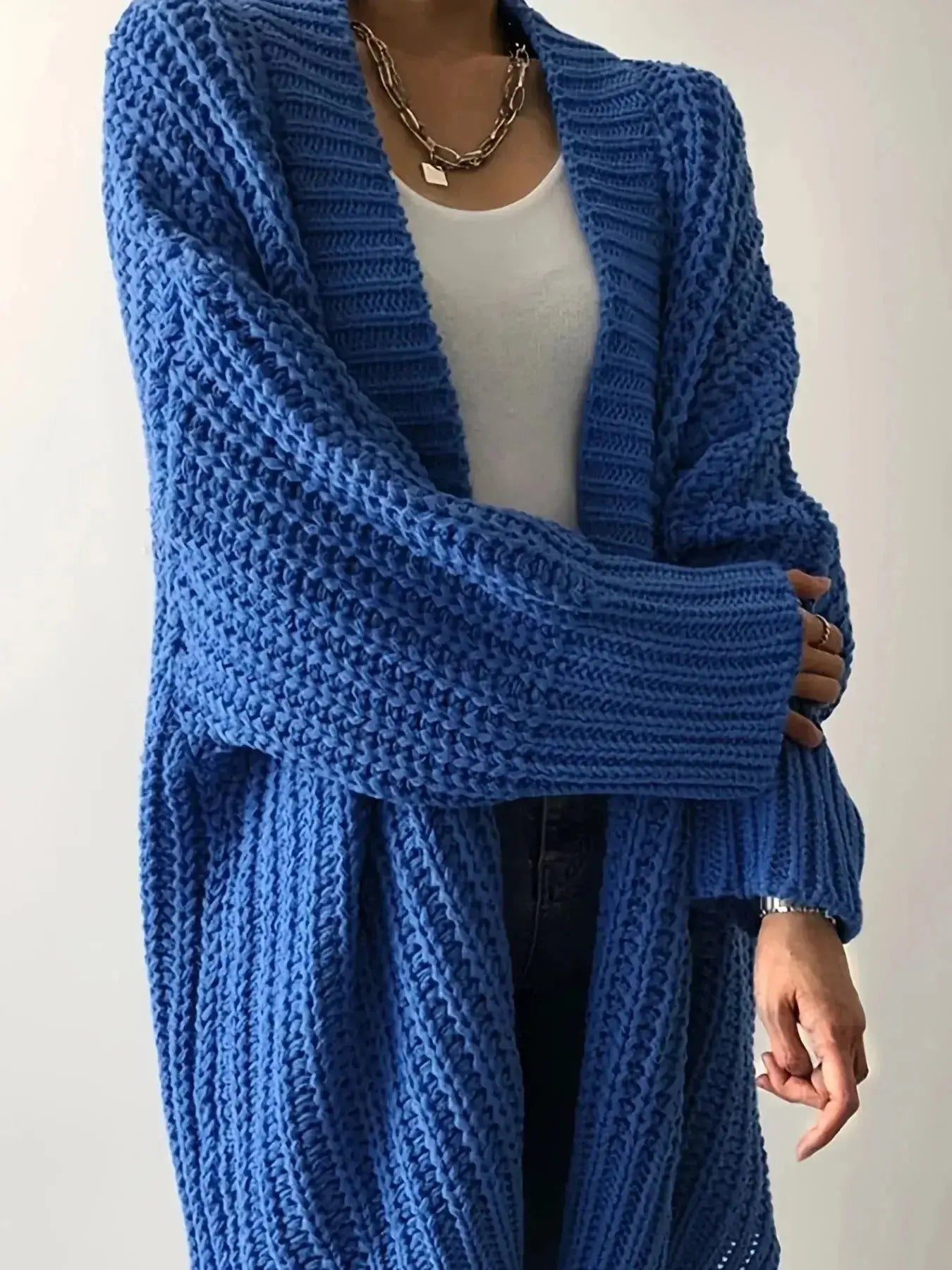 Women's chunky knit open-front cardigan with long sleeves, cozy layering sweater from Plush Fashion Hub.