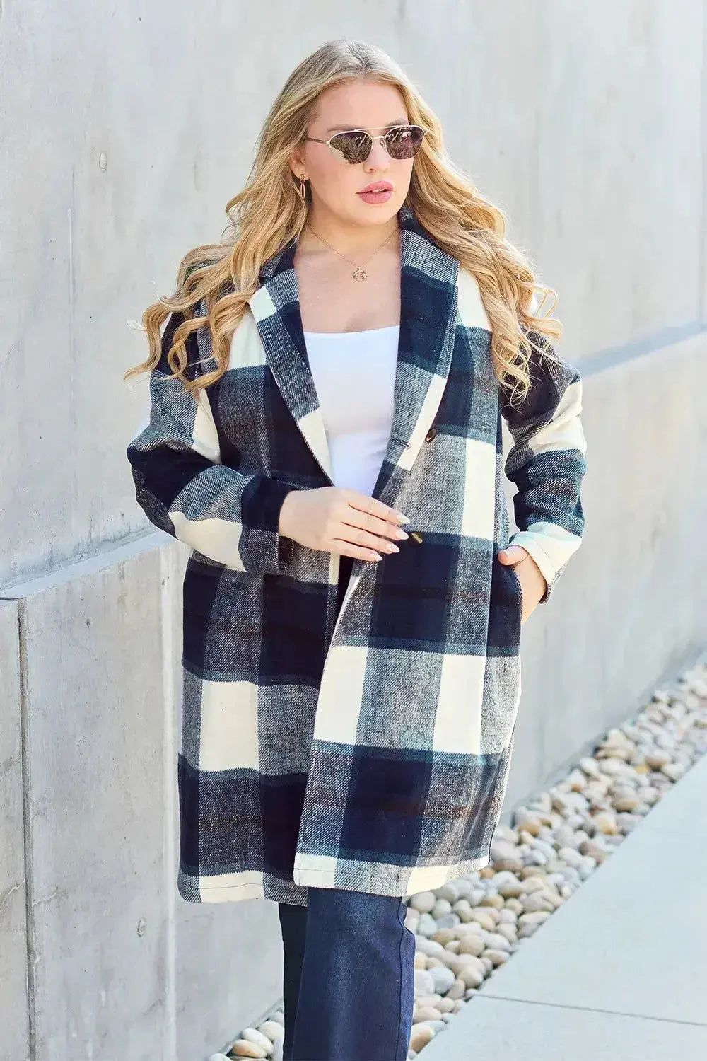 Women's plaid button-up lapel coat featuring a wool-feel fabric, ideal for seasonal outerwear, made by Trendsi.