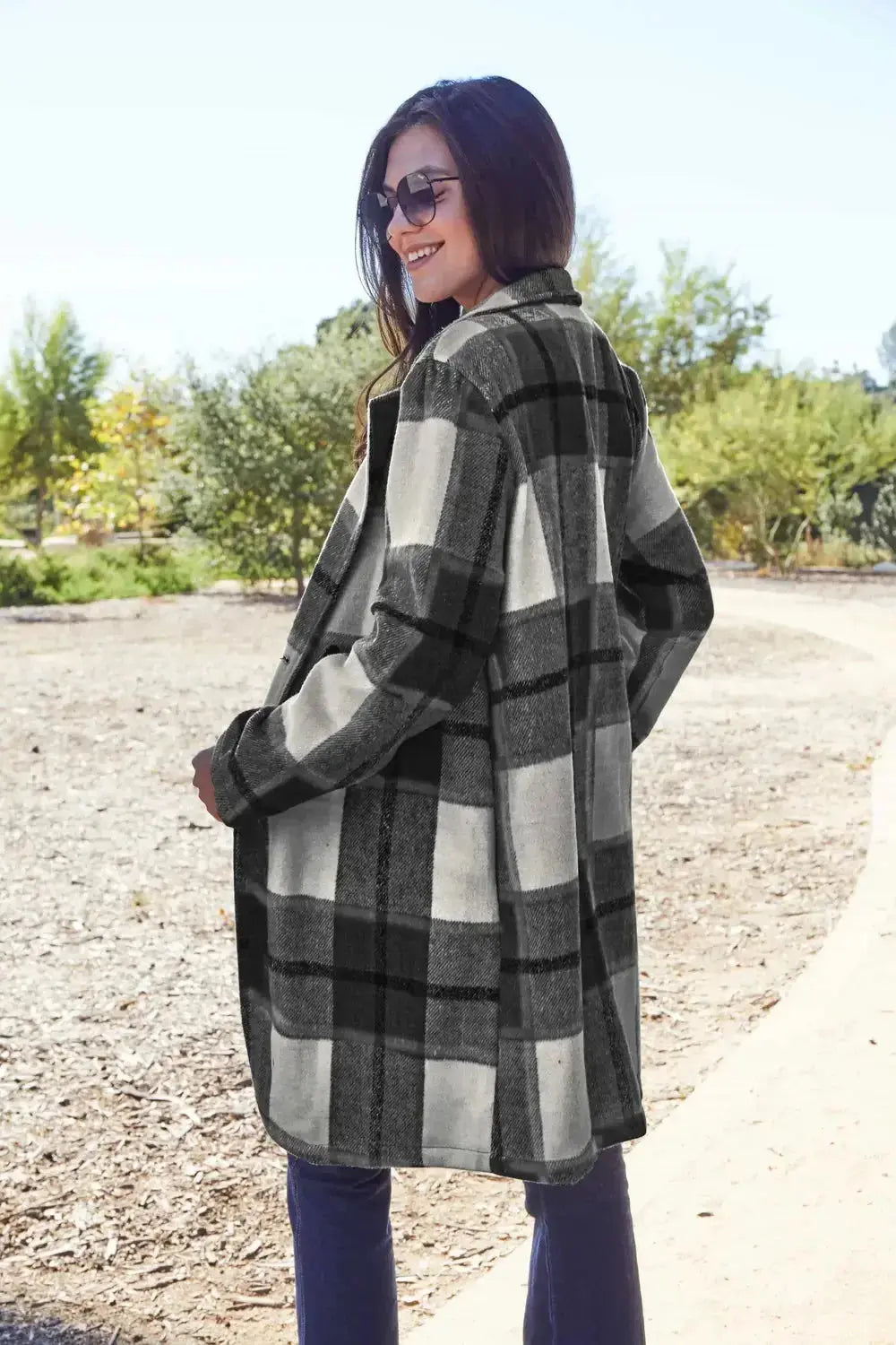 Women's classic plaid button-up lapel coat with wool-feel fabric, stylish seasonal outerwear by Trendsi.
