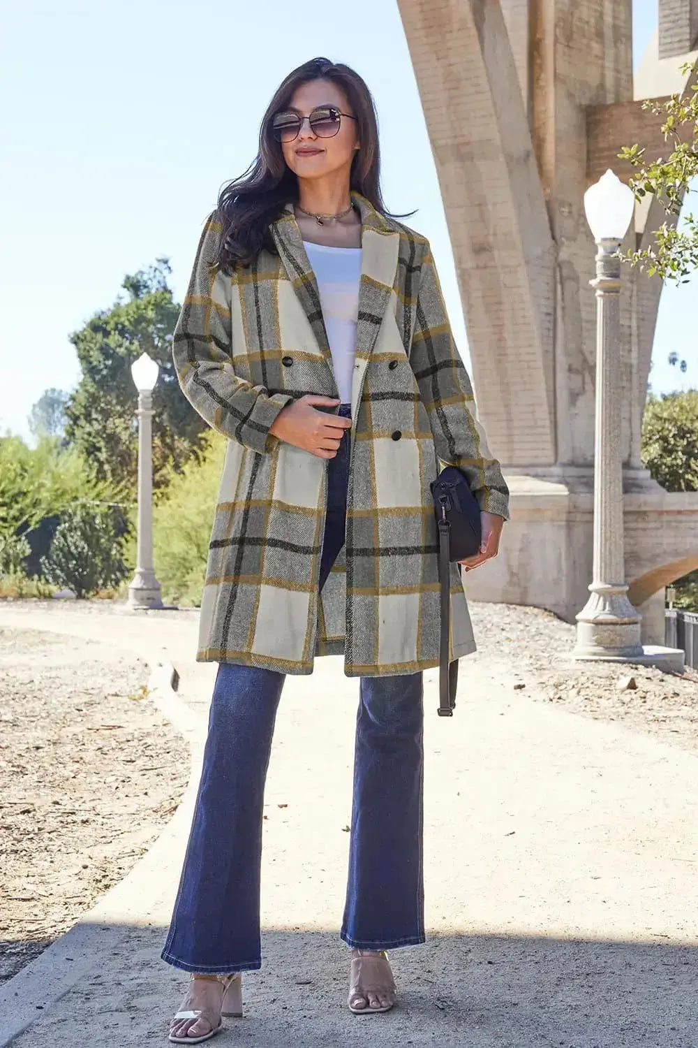 Women's classic plaid button-up lapel coat with wool-feel fabric, seasonal outerwear by Trendsi, shown in a stylish, buttoned-up design.