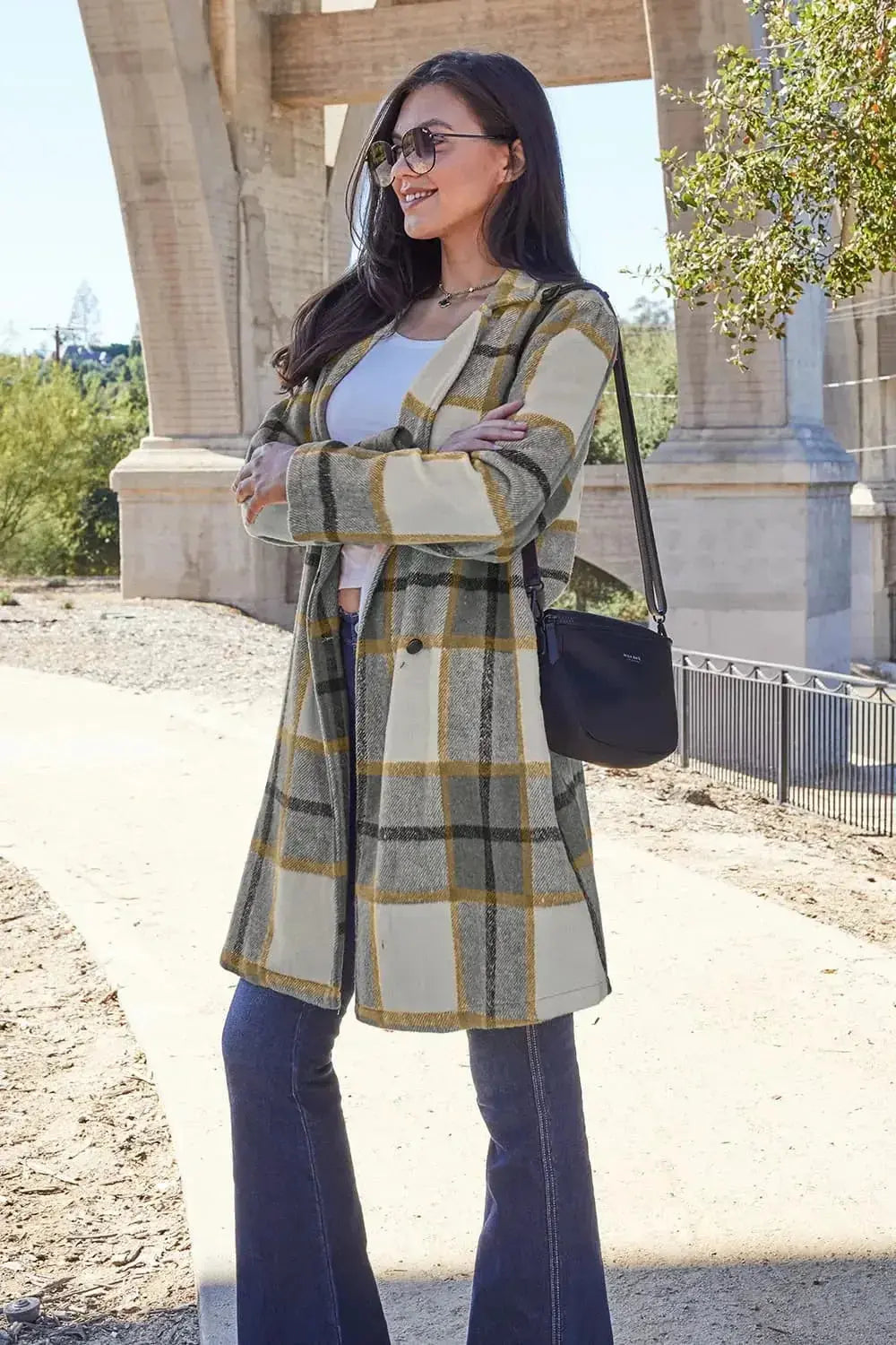 Women's plaid button-up lapel coat with wool-feel fabric, seasonal outerwear by Trendsi, featuring classic plaid pattern and tailored fit.