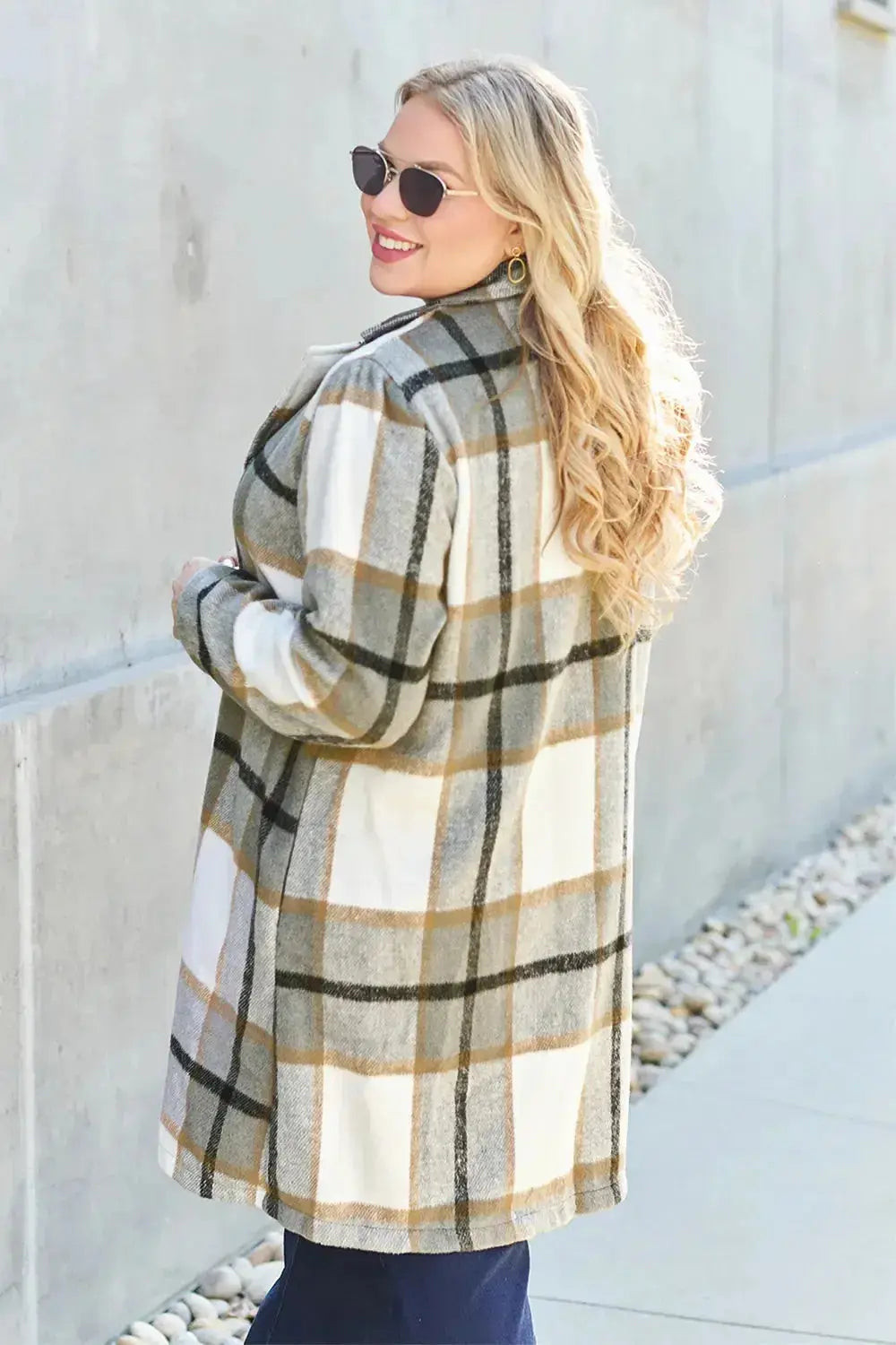 Women's classic plaid button-up lapel coat by Trendsi, wool-feel outerwear with a timeless plaid pattern and tailored design.