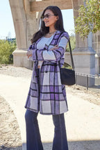 Women's classic plaid button-up lapel coat by Trendsi, featuring a wool-feel outerwear design with stylish seasonal warmth.