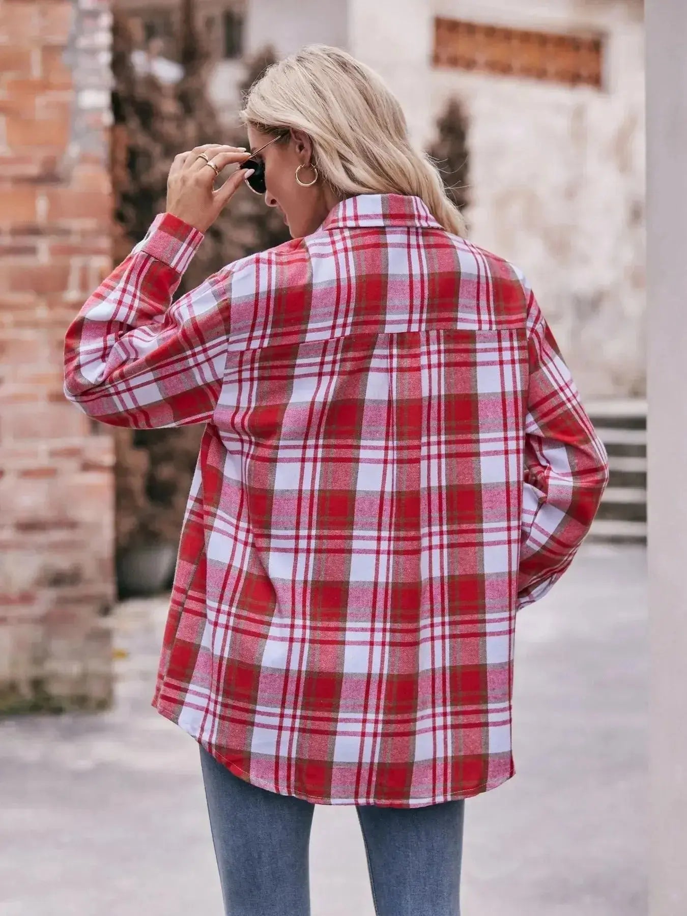 Women’s classic plaid long sleeve button-down shirt by Trendsi, featuring a timeless pattern and casual fit.