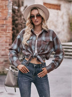 Women’s classic plaid long sleeve button-down shirt by Trendsi, featuring a timeless pattern and casual fit.