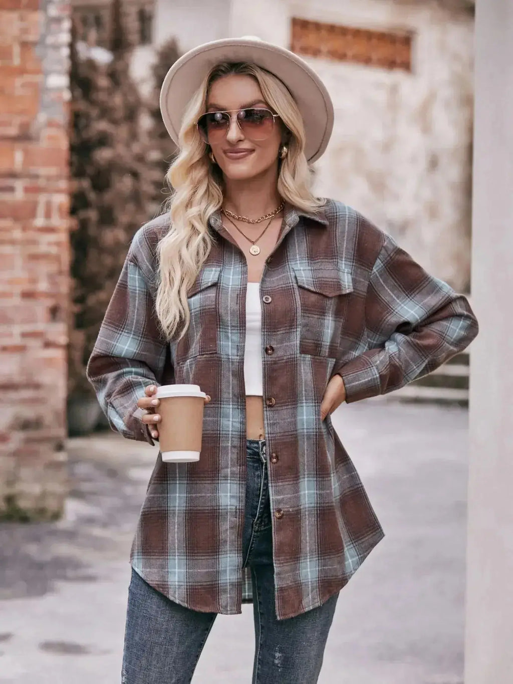 Women's classic plaid long sleeve button-down shirt by Trendsi, featuring a stylish button-up design and timeless plaid pattern.