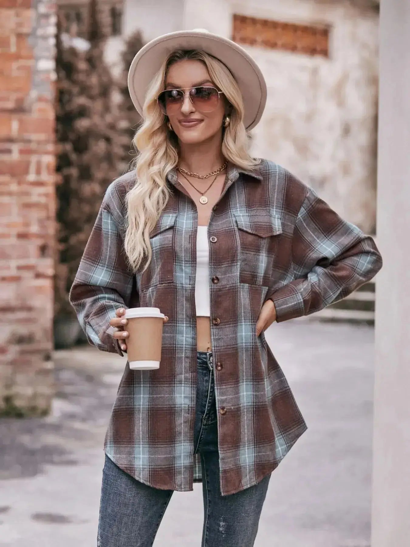 Women's classic plaid long sleeve button-down shirt by Trendsi, featuring a stylish button-up design and timeless plaid pattern.
