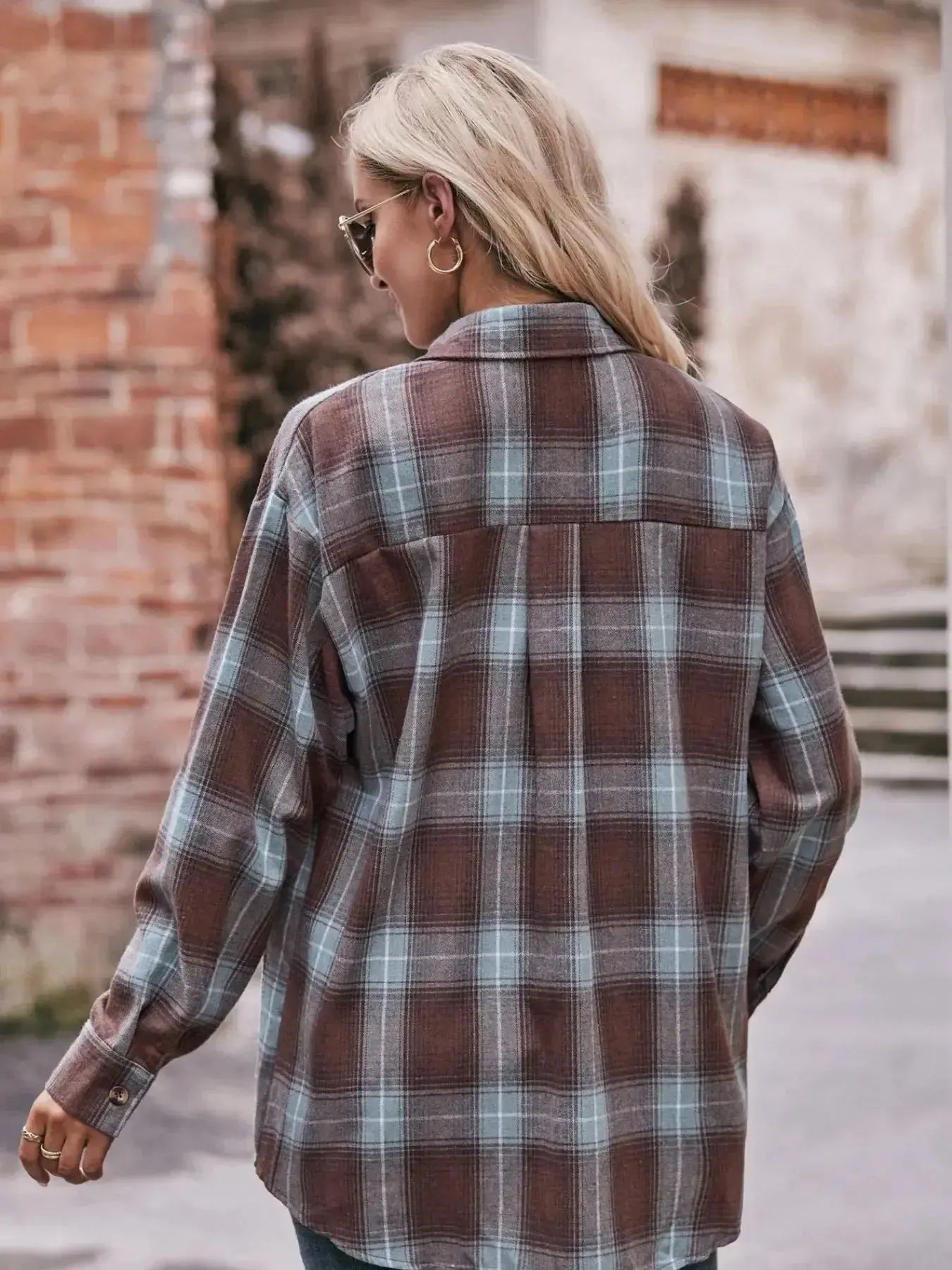 Women’s classic plaid long sleeve button-down shirt by Trendsi, featuring a stylish pattern and tailored fit.