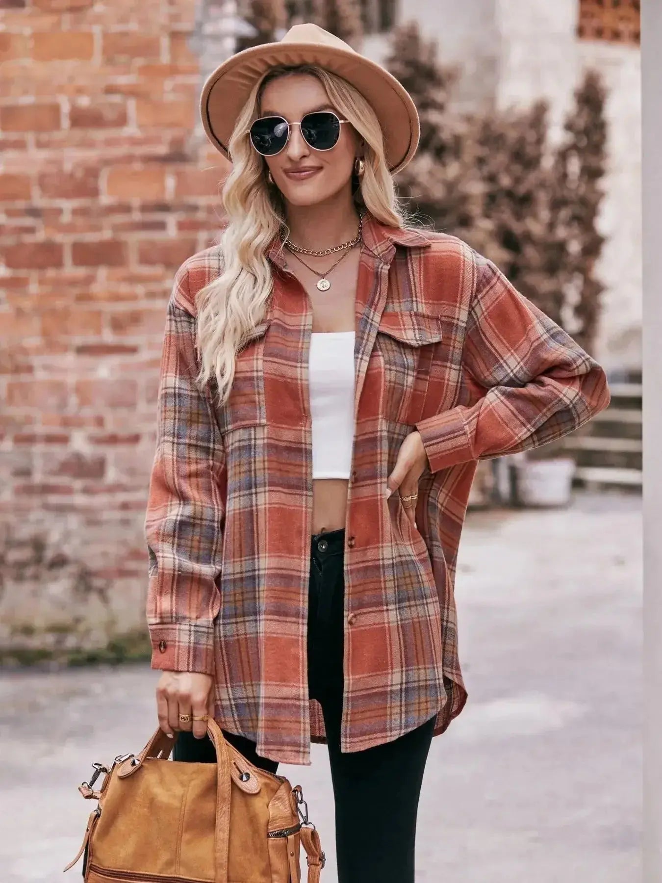 Women's classic plaid long sleeve button-down shirt by Trendsi, featuring a stylish pattern and tailored fit.