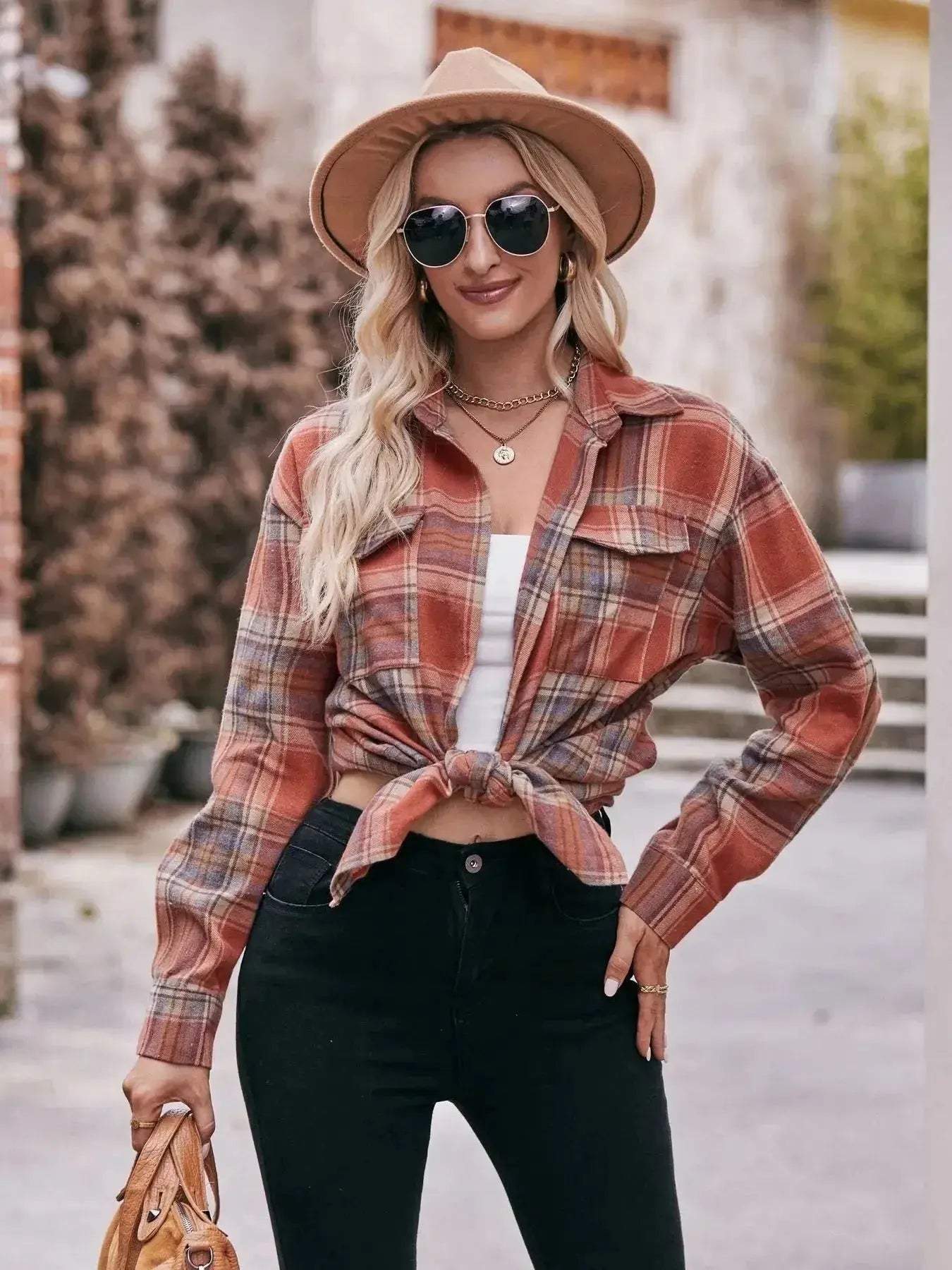Women’s classic plaid long sleeve button-down shirt by Trendsi, featuring a traditional checkered pattern and collar.