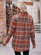 Women’s classic plaid long sleeve button-down shirt by Trendsi, featuring a traditional checkered pattern and collared design.