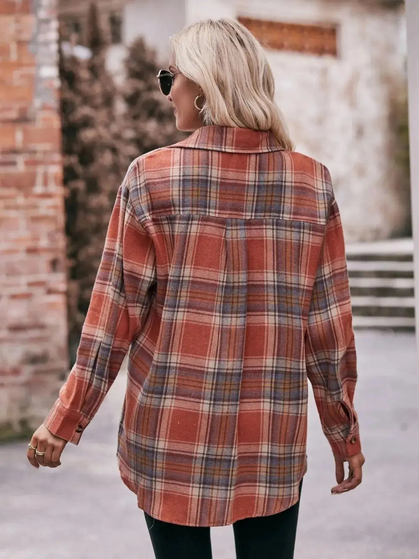 Women’s classic plaid long sleeve button-down shirt by Trendsi, featuring a traditional checkered pattern and collared design.