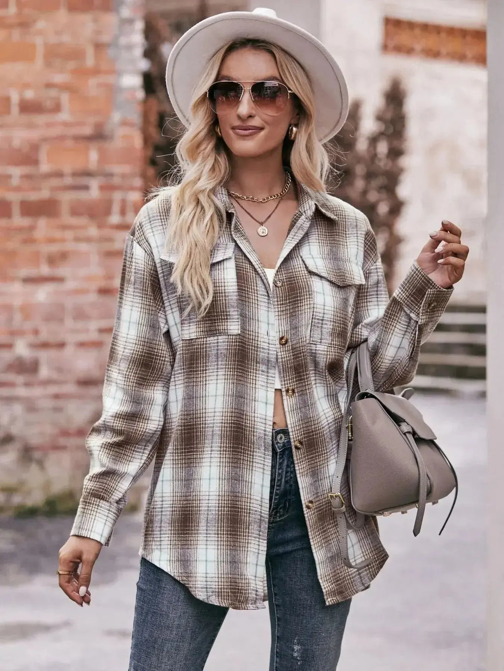 Women’s classic plaid long sleeve button-down shirt by Trendsi, featuring a traditional checkered pattern and collar detail.