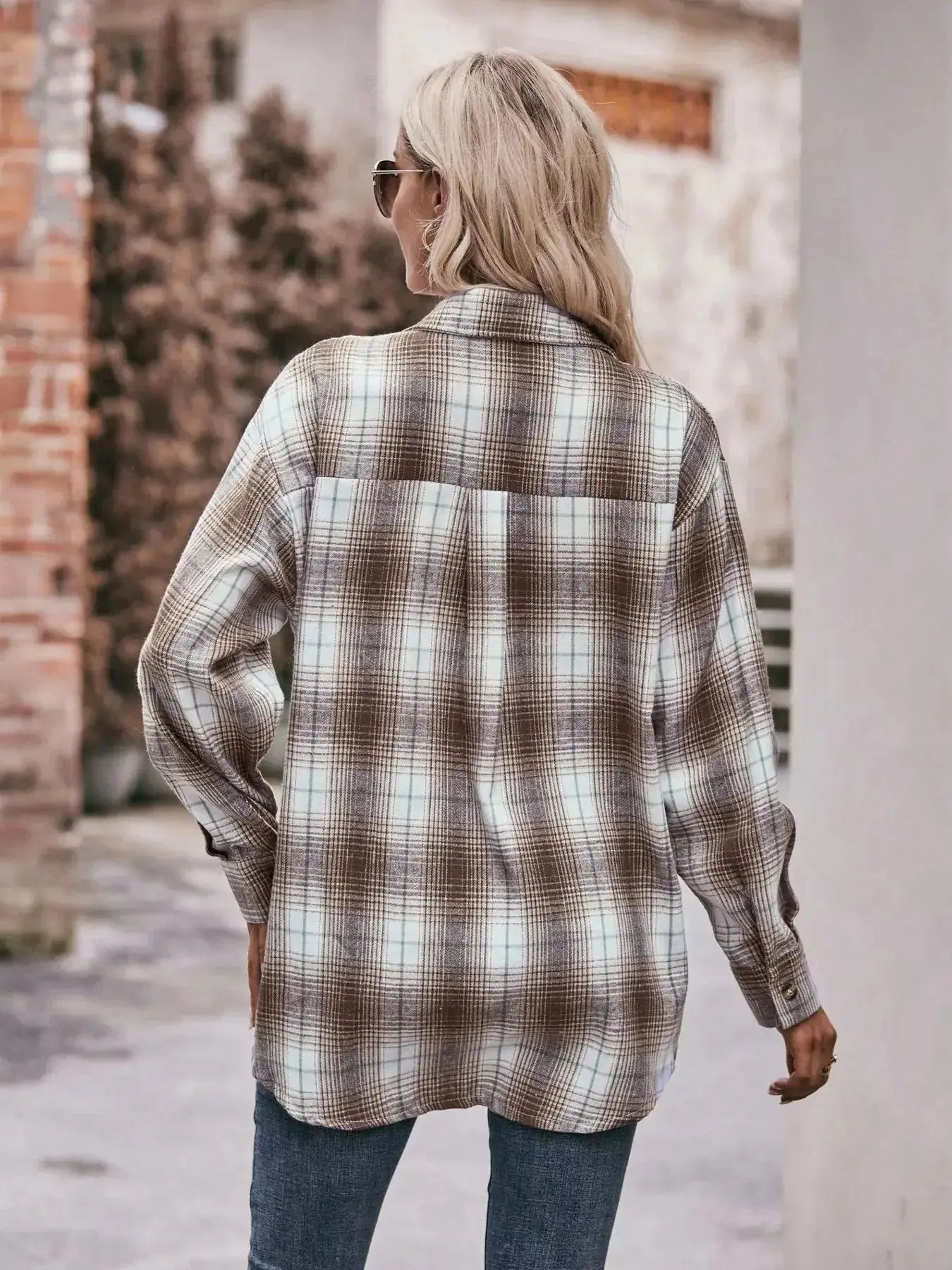 Women's classic plaid long sleeve button-down shirt by Trendsi, featuring a timeless pattern and tailored fit.