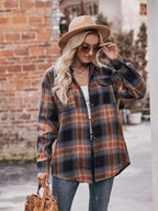 Women's classic plaid long sleeve button-down shirt by Trendsi, featuring a timeless pattern and tailored fit.
