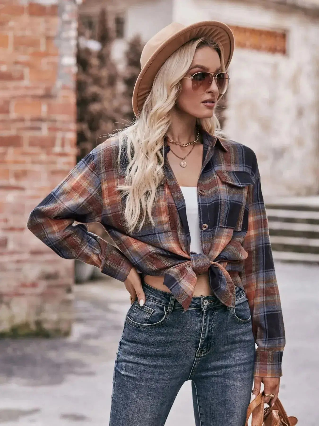 Women’s classic plaid long sleeve button-down shirt by Trendsi, featuring a stylish plaid pattern and button-front design.