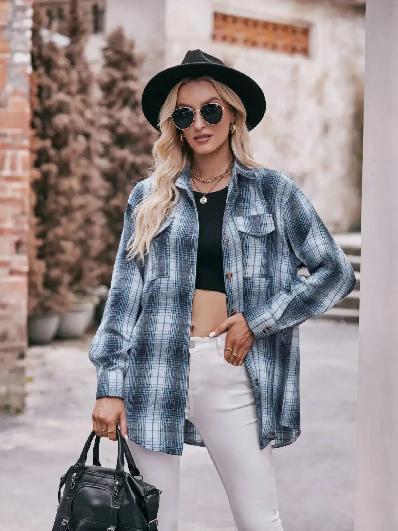 Women’s classic plaid long sleeve button-down shirt by Trendsi, featuring a stylish plaid pattern and button front.