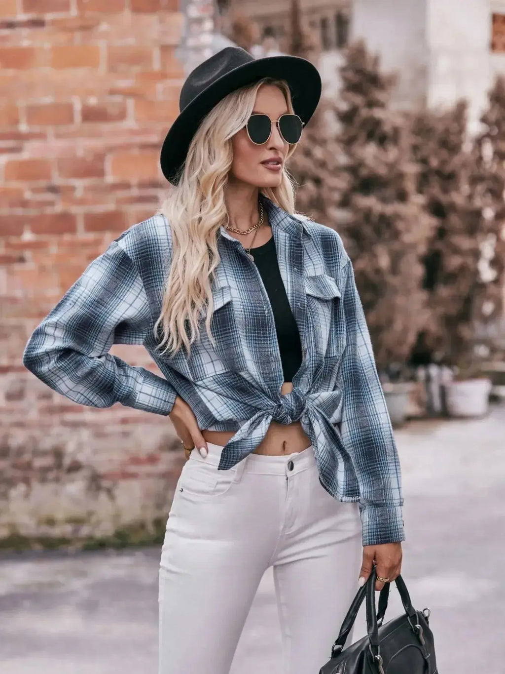 Women’s classic plaid long sleeve button-down shirt by Trendsi, featuring a stylish, casual design with a collar and button front.