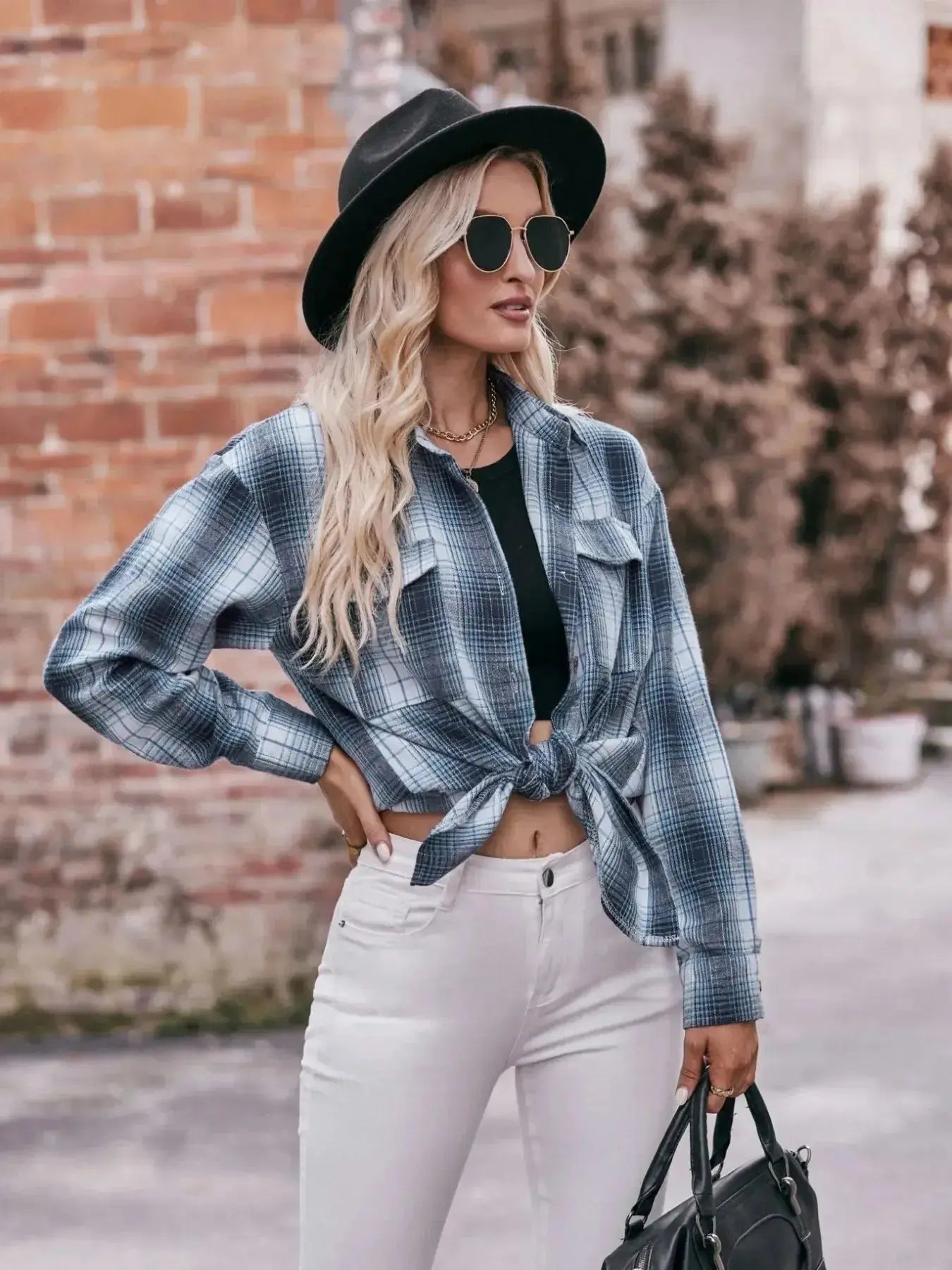 Women’s classic plaid long sleeve button-down shirt by Trendsi, featuring a stylish, casual design with a collar and button front.