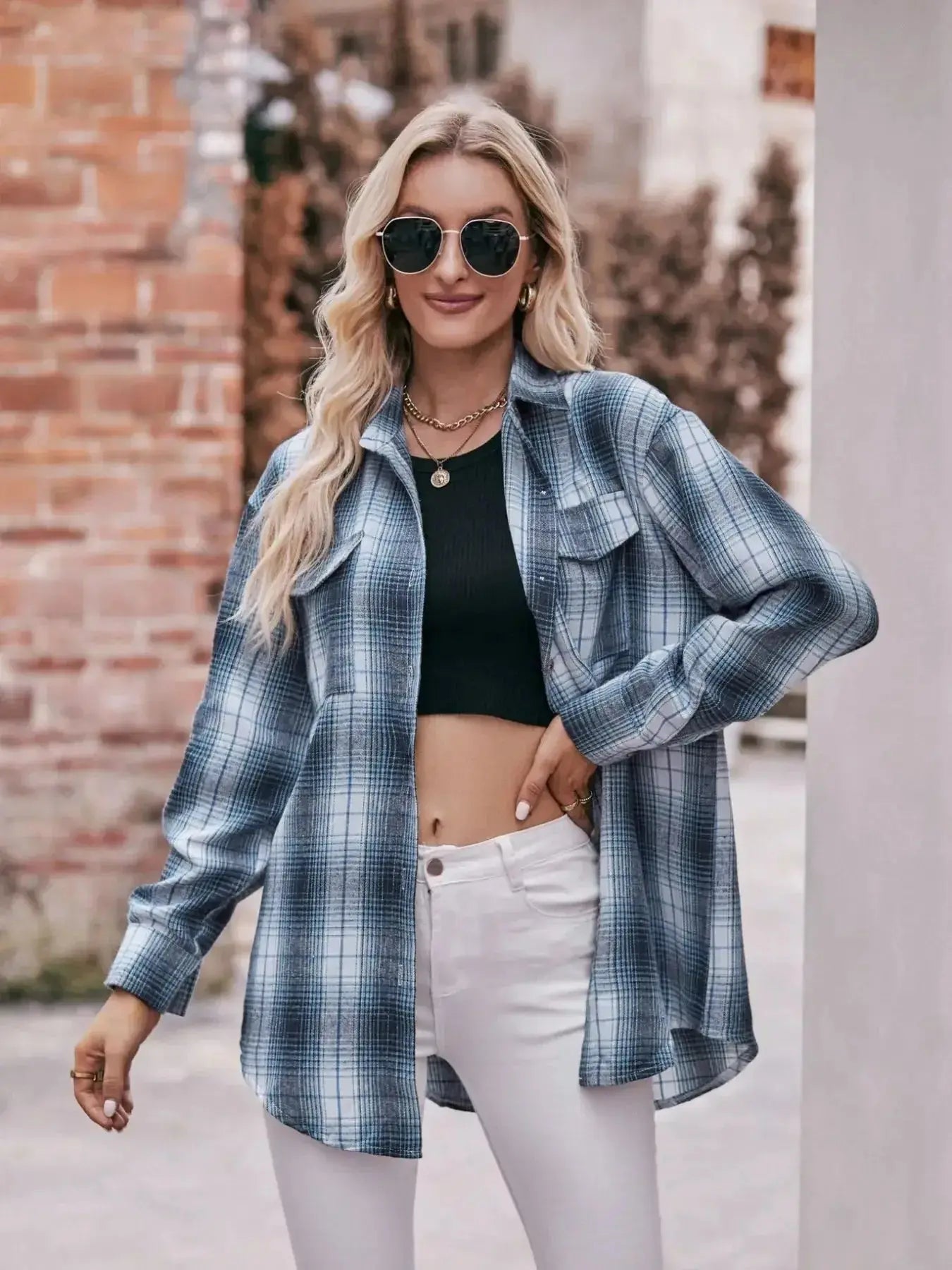 Women’s classic plaid long sleeve button-down shirt by Trendsi, featuring a stylish checkered pattern and collared design.