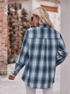 Women’s classic plaid long sleeve button-down shirt by Trendsi, featuring a timeless design and button-front closure.
