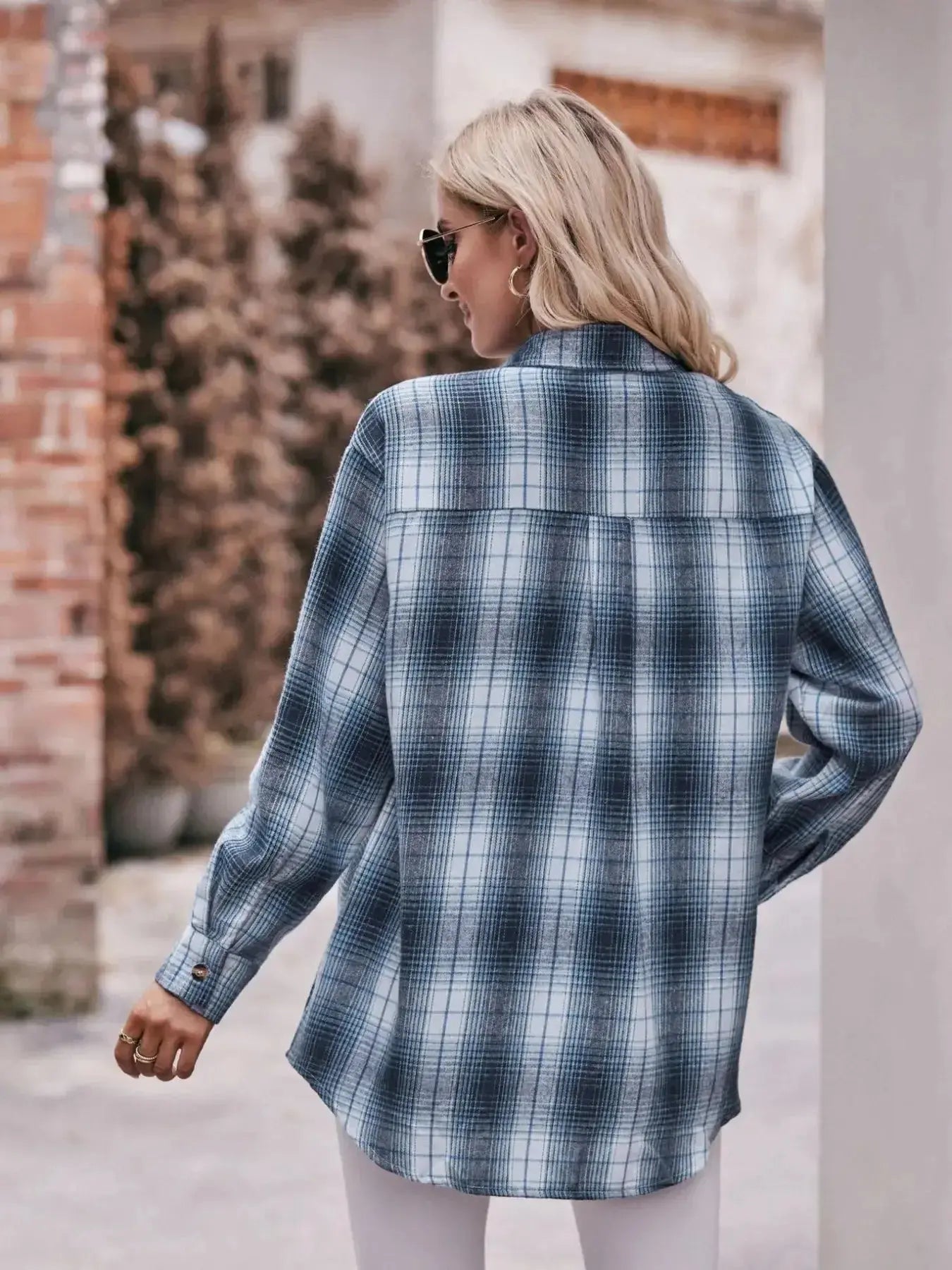 Women’s classic plaid long sleeve button-down shirt by Trendsi, featuring a timeless design and button-front closure.