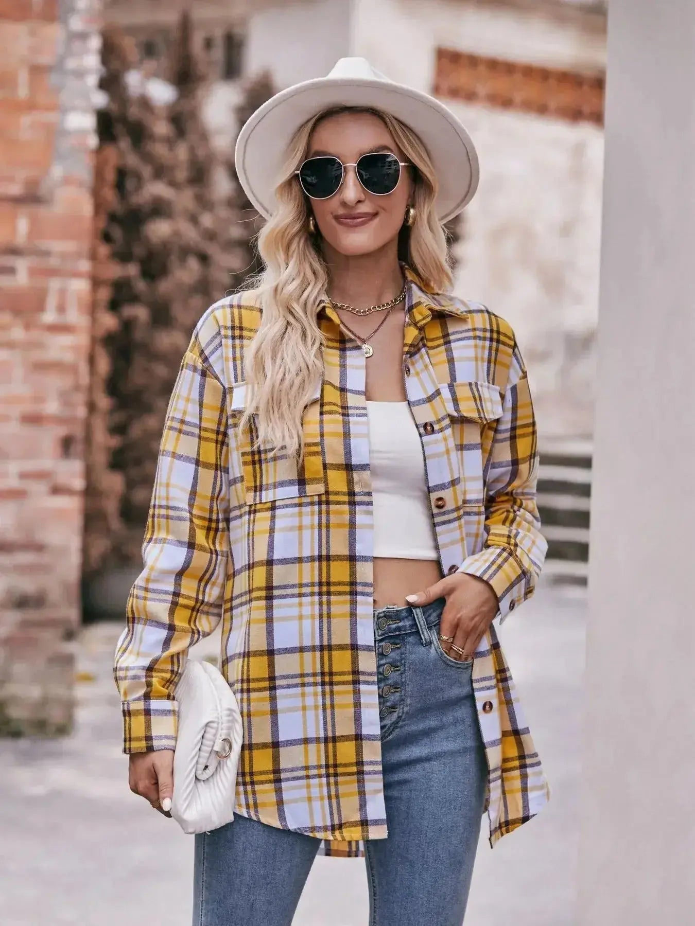 Women's classic plaid long sleeve button-down shirt by Trendsi, featuring traditional design and button-front closure.