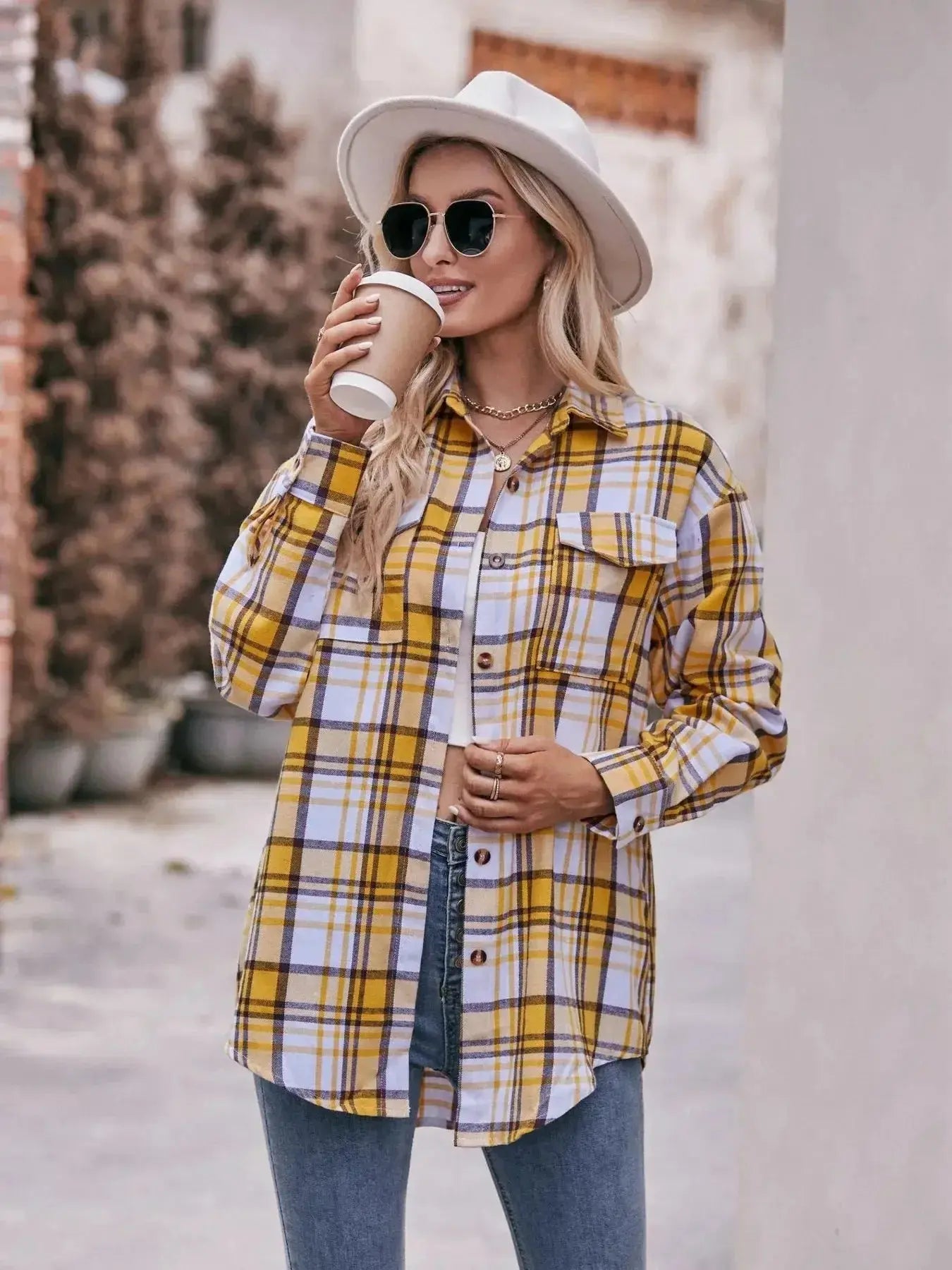 Women’s classic plaid long sleeve button-down shirt by Trendsi, featuring a timeless pattern and comfortable fit.