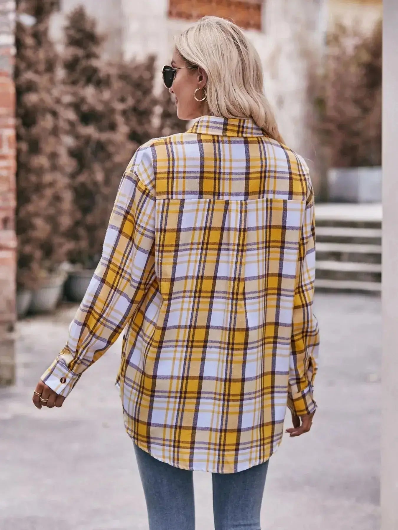 Women’s classic plaid long sleeve button-down shirt by Trendsi, featuring a timeless pattern and casual fit.