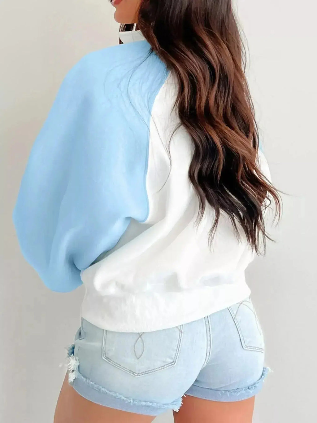 Women's color block sweatshirt with snap buttons, soft cotton blend pullover by Plush Fashion Hub, stylish and comfortable.