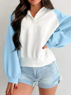Women's color block sweatshirt with snap buttons, soft cotton blend pullover from Plush Fashion Hub, featuring bold color blocks and casual style.