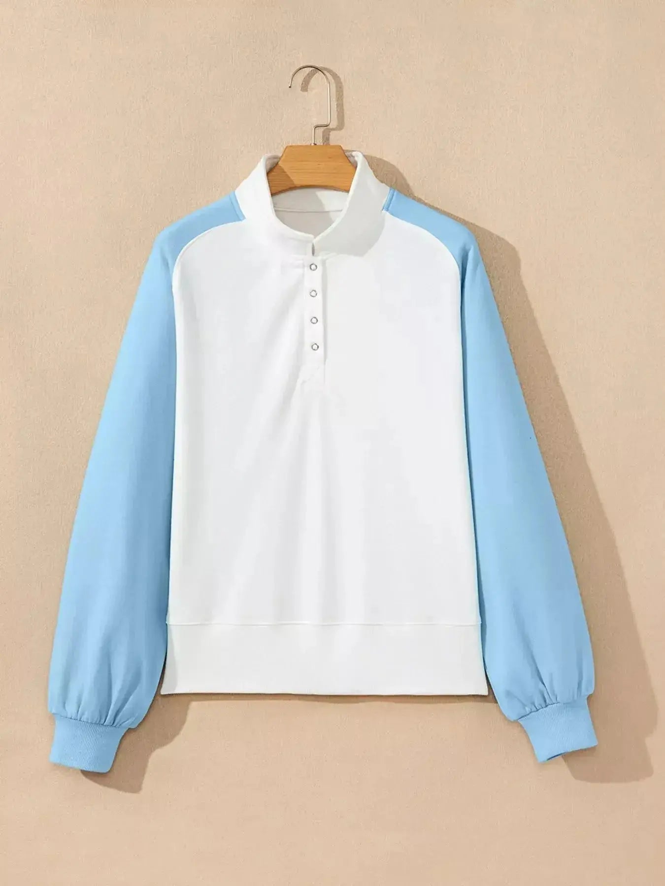 Women's color block snap button sweatshirt by Plush Fashion Hub, soft cotton blend pullover with vibrant color blocking and casual fit.