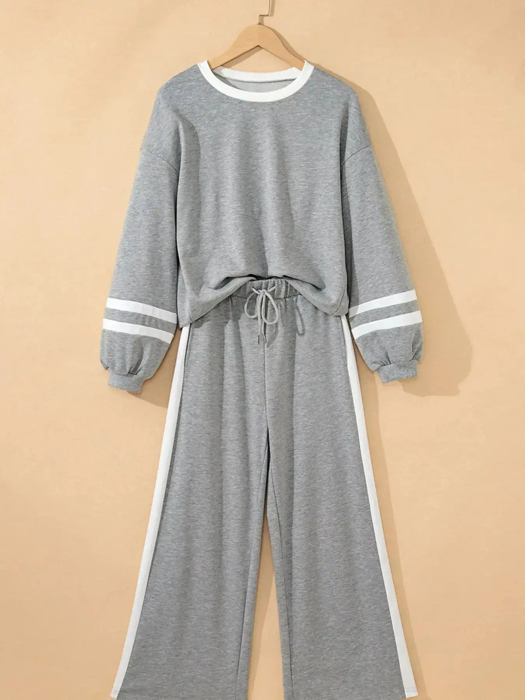 Plush Fashion Hub contrast trim round neck lounge set with cozy two-piece top and matching pants, comfortable loungewear ensemble.