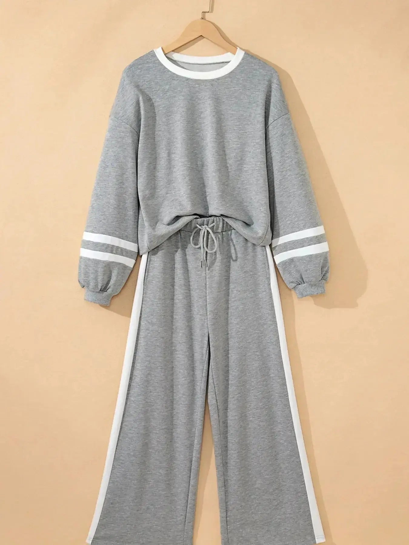Plush Fashion Hub contrast trim round neck lounge set with cozy two-piece top and matching pants, comfortable loungewear ensemble.