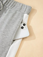 Plush Fashion Hub contrast trim round neck lounge set with cozy two-piece top and pants, perfect for comfortable casual wear.