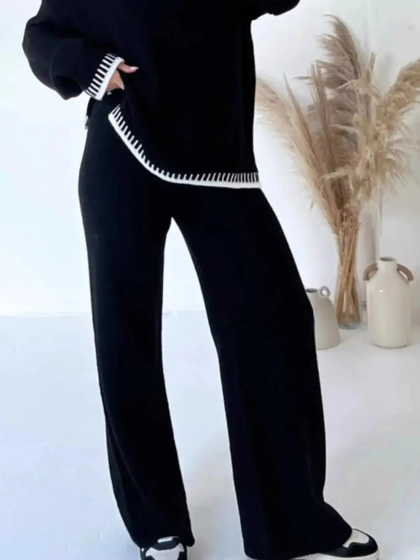 Contrast trim round neck sweater top and wide-leg pants lounge set by Trendsi, featuring cozy knit fabric and stylish relaxed fit.