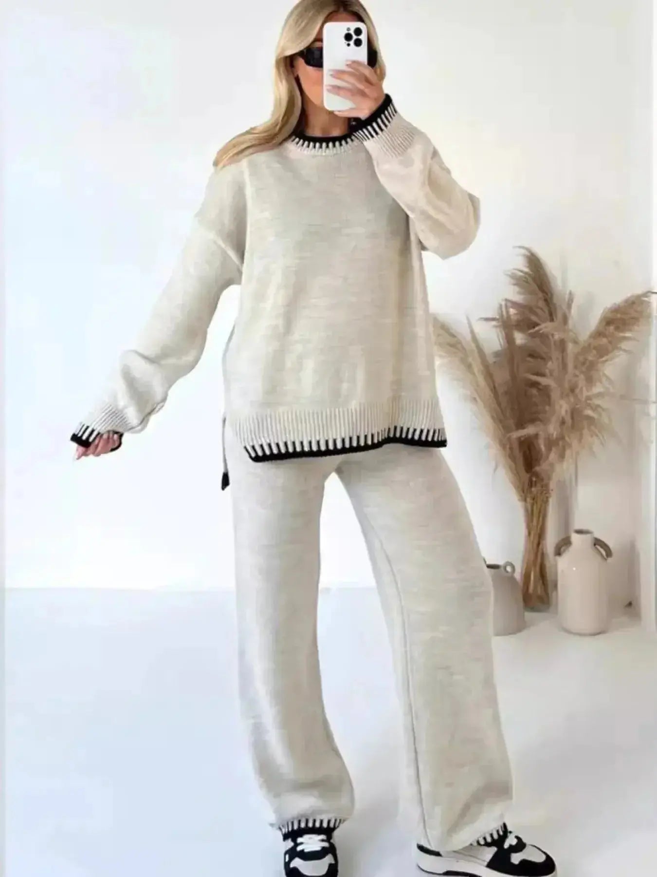 Contrast trim round neck sweater top and wide-leg pants lounge set by Trendsi, featuring cozy knit fabric and stylish design.