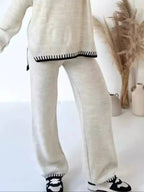 Contrast trim round neck sweater top and wide-leg pants lounge set by Trendsi, featuring comfortable knit fabric and stylish design.