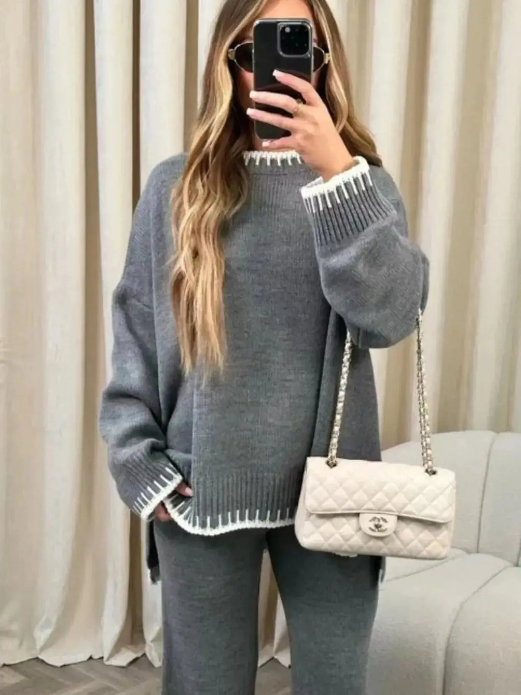 Contrast trim round neck sweater top and wide-leg pants lounge set by Trendsi, featuring a comfortable, stylish casual outfit.